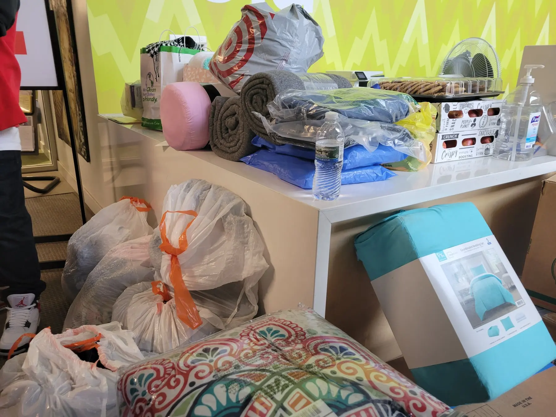 Blankets, warm clothing, and non-perishable food ready to give